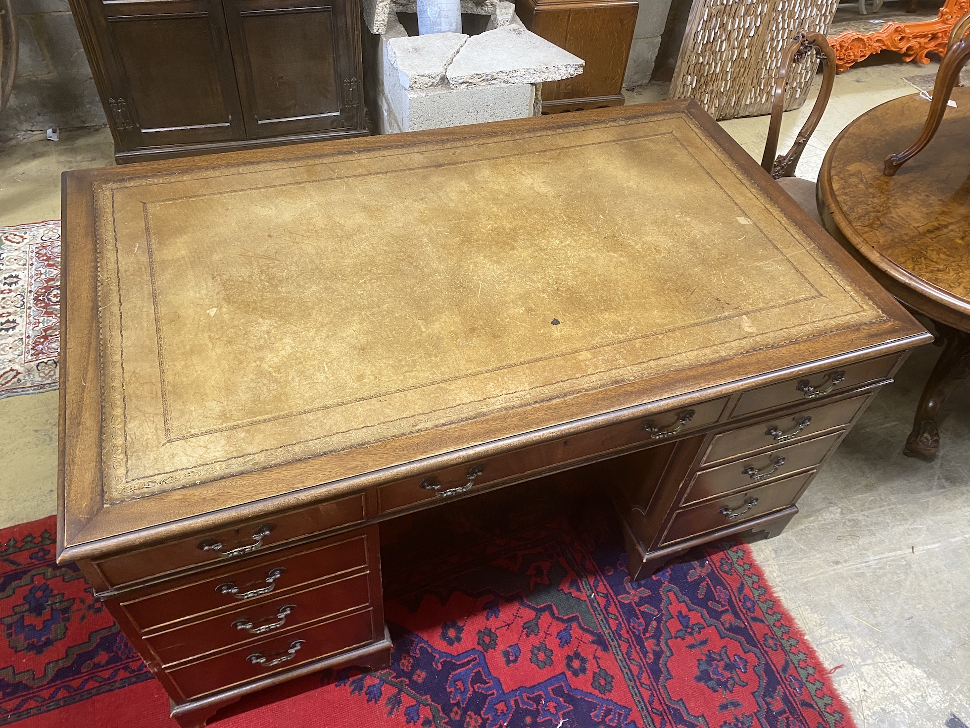 A reproduction George III style mahogany pedestal desk, length 154cm, depth 91cm, height 77cm